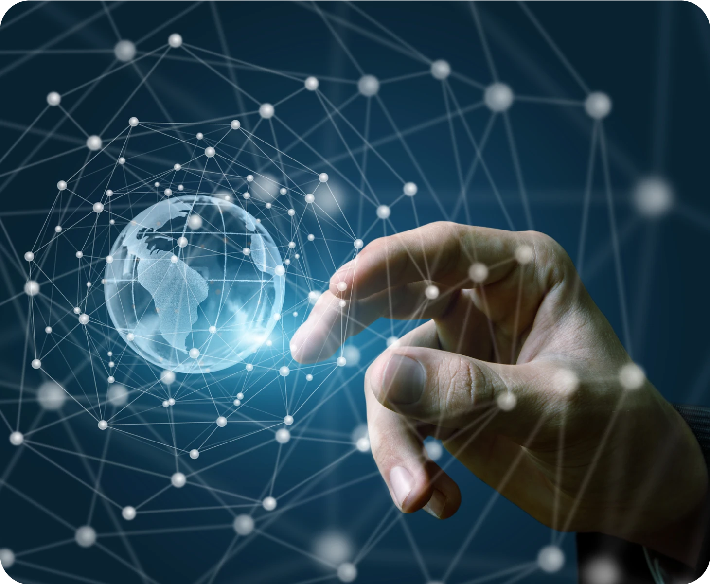 A man's hand is touching a globe on a network.